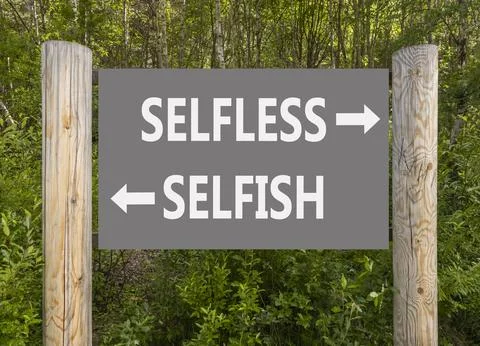 Selfless instead selfish words symbol. Concept words Selfless Selfish on be.. Fotos de archivo