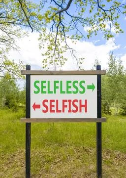 Selfless instead selfish words symbol. Concept words Selfless Selfish on be.. Fotos de archivo