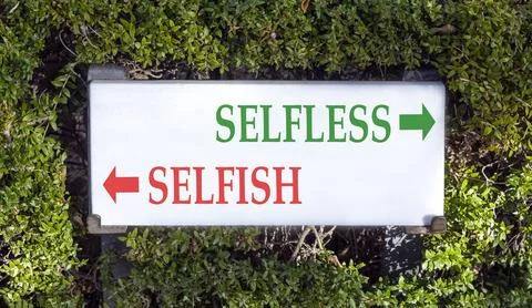 Selfless instead selfish words symbol. Concept words Selfless Selfish on be.. Fotos de archivo