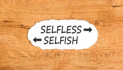 Selfless instead selfish words symbol. Concept words Selfless Selfish on be.. Fotos de archivo