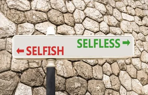 Selfless instead selfish words symbol. Concept words Selfless Selfish on be.. Fotos de archivo