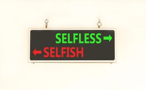 Selfless instead selfish words symbol. Concept words Selfless Selfish on be.. Fotos de archivo