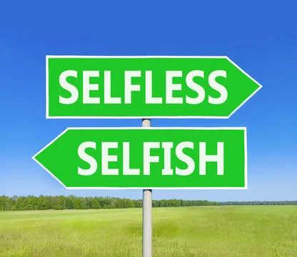 Selfless instead selfish words symbol. Concept words Selfless Selfish on be.. Fotos de archivo