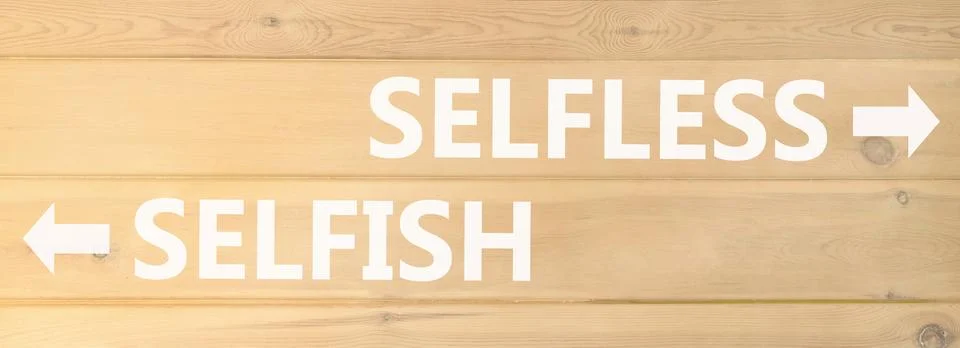 Selfless instead selfish words symbol. Concept words Selfless Selfish on be.. Fotos de archivo