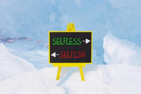 Selfless instead selfish words symbol. Concept words Selfless Selfish on be.. Fotos de archivo