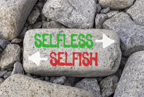 Selfless instead selfish words symbol. Concept words Selfless Selfish on be.. Fotos de archivo