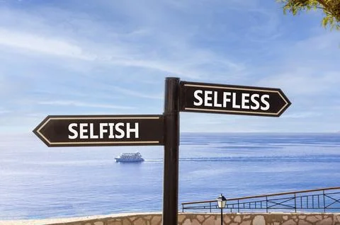 Selfless instead selfish words symbol. Concept words Selfless Selfish on be.. Fotos de archivo