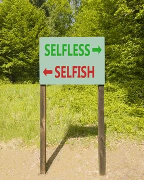 Selfless instead selfish words symbol. Concept words Selfless Selfish on be.. Fotos de archivo