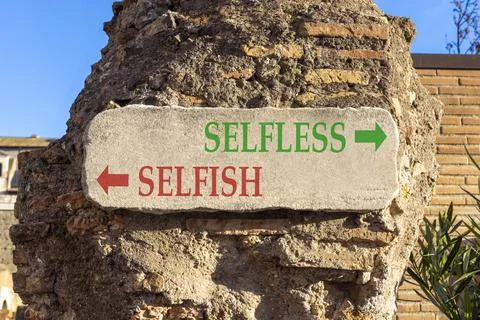Selfless instead selfish words symbol. Concept words Selfless Selfish on be.. Fotos de archivo