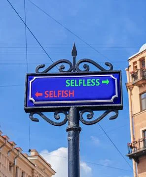 Selfless instead selfish words symbol. Concept words Selfless Selfish on be.. Fotos de archivo