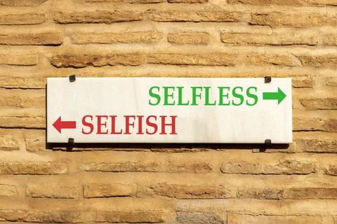 Selfless instead selfish words symbol. Concept words Selfless Selfish on be.. Fotos de archivo