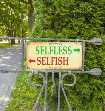 Selfless instead selfish words symbol. Concept words Selfless Selfish on beau Fotos de archivo