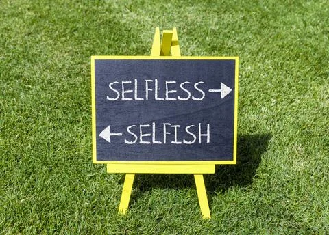 Selfless instead selfish words symbol. Concept words Selfless Selfish on beau Fotos de archivo