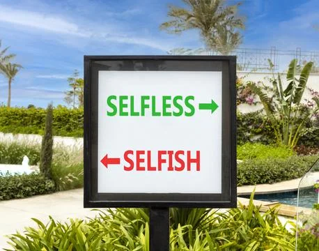 Selfless instead selfish words symbol. Concept words Selfless Selfish on be.. Fotos de archivo