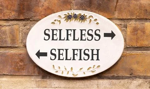 Selfless instead selfish words symbol. Concept words Selfless Selfish on be.. Fotos de archivo