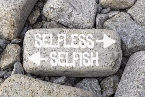 Selfless instead selfish words symbol. Concept words Selfless Selfish on be.. Fotos de archivo