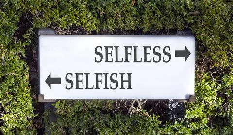 Selfless instead selfish words symbol. Concept words Selfless Selfish on be.. Fotos de archivo
