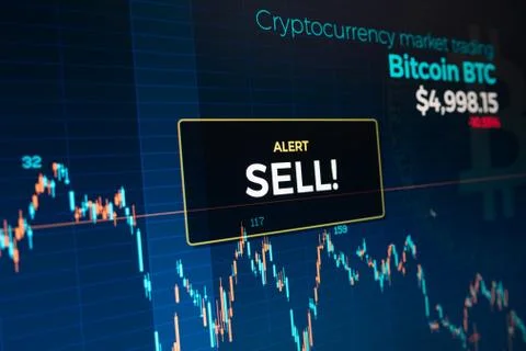 Sell alert on Bitcoin cryptocurrency graph chart screen Stock Photos