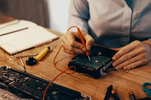 Sell save the data too. an unrecognizable female computer technician repairing a Stock Photos