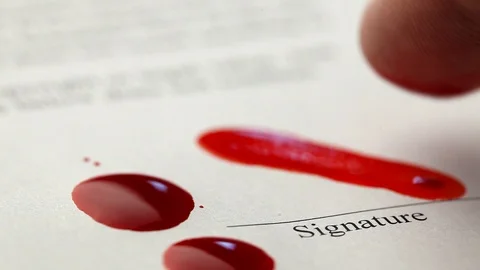 Sell the soul to the devil. Signed contract with Satan. Blood with finger to Stock Footage 109794973
