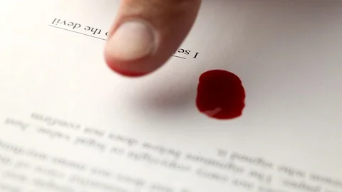 Sell the soul to the devil. Signed contract with Satan. Blood with finger to Stock Footage 110624334