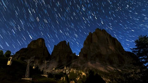 Sella Pass star trails in semmer night Stock Footage 129594386