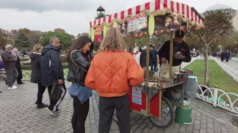 Seller of boiled corn and roasted chestnuts in Sultanahmet square, Istanbul. Stock Footage 166447704