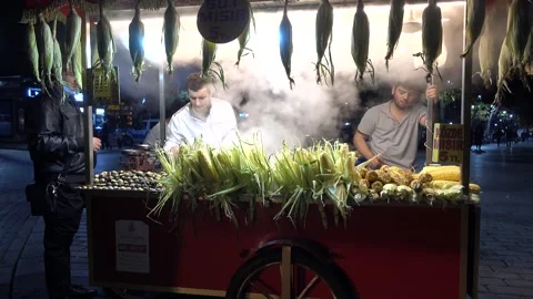 Seller boiled corn on Sultanahmet Square, Istanbul evening. Turkey Stock Footage 164684783