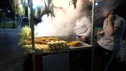 Seller boiled corn on Sultanahmet Square, Istanbul evening. Turkey Stock Footage 164684785