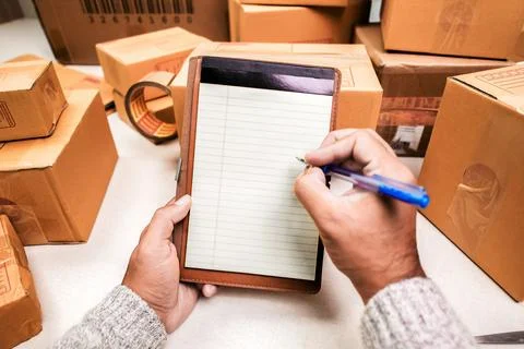 Seller Checking Packing boxes Stock Photos