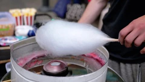 Seller Makes Cotton Candy, a Machine for Making Cotton Candy on the Street Stock Footage 293175625