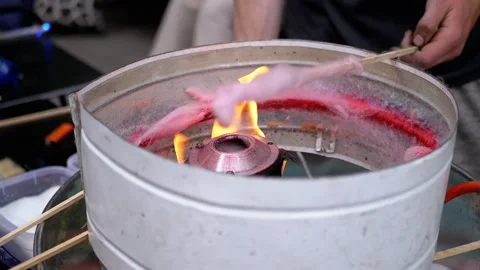 Seller Makes Cotton Candy, a Machine for Making Cotton Candy on the Street Stock Footage 293176926