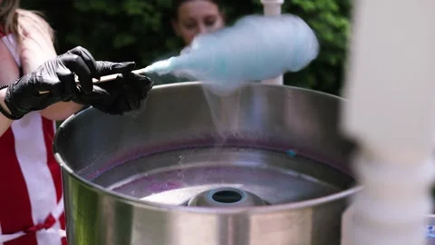 Seller Makes Cotton Candy, a Machine for Making Cotton Candy on the Street. Stock Footage 311024609