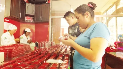 Seller Making Her Part To Wrap Hundres Of Candy Stock Footage 88449821
