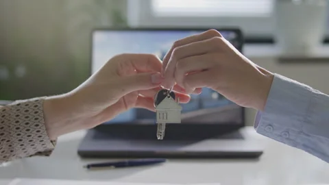 Seller Passing Keys to Client during Real Estate Agreement in Office Video stock 314837425