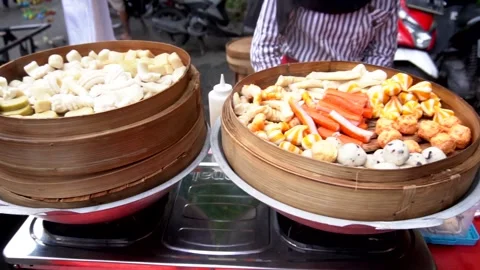 Seller preparing selling Dumpling to customers at Asian Street Food Indonesia. Stock Footage 228890557