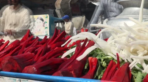 Selling carrots on the roadside in Pakistan Stock Footage