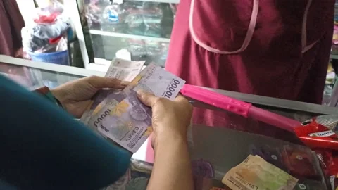 Selling clothes when serving customers  Stock Footage 231369847