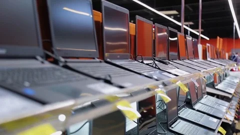 Selling laptops in electronics store Stock-Footage 77834830