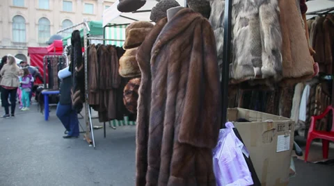 Selling natural fur coats, clothes made from animal furry, winter fur hats Stock Footage