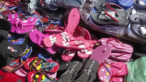 Selling some sandals Stock Footage 234407209
