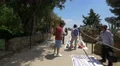 Selling souvenirs and hats in Park Guell, Barcelona 4k or 4k+ Resolution