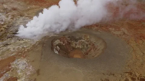 Seltun geothermal mud pool releases dense steam from a mineral crater in Stock Footage 342758091