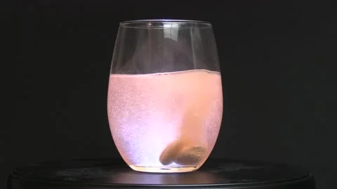 Seltzer tablets fizzing in a glass. Stock Footage 155178484