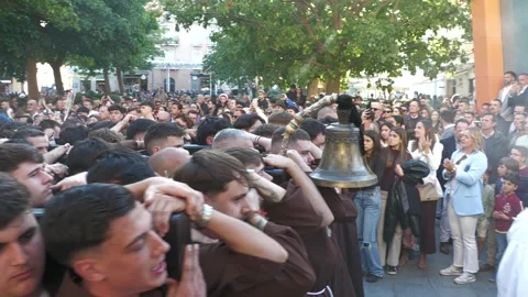 Semana Santa Carriers With Procession Bell in Malaga Spain Stock Footage 335942565