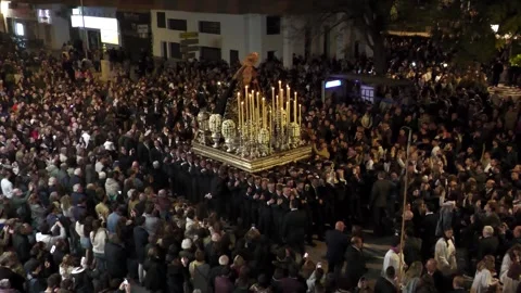 Semana Santa Float Carried Through Crowd in Malaga at Night Stock Footage 336015162