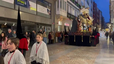 Semana Santa Procession with Religious Float Moving Through Bilbao Street Stock Footage 332154148