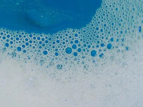 Semi-abstract picture of the pattern of white bubbles against a blue background Stock Photos