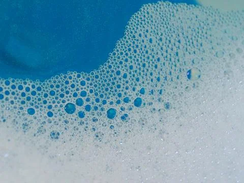 Semi-abstract picture of the pattern of white bubbles against a blue background Stock Photos