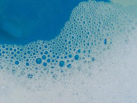 Semi-abstract picture of the pattern of white bubbles against a blue background Stock Photos